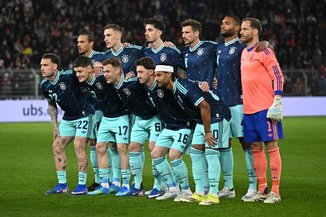 Germany's starting squad pose for a group picture ahead of the international friendly football match between Switzerland and Germany at St.Jakob-Park in Basel, Switzerland on March 27, 2026. (Photo by Fabrice COFFRINI / AFP)