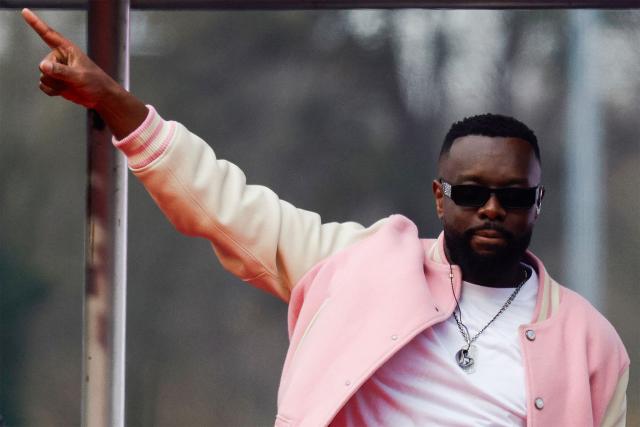 (FILES) Congolese singer, rapper, and singer-songwriter GIMS, formerly known as Maître Gims, performs during the opening ceremony of the 105th Grand Prix d'Amerique harness racing horse race at Vincennes Hippodrome in Paris on January 25, 2026. The Congolese singer Gims, France's most-listened artist in 2025, was indicted on March 27, 2026, on charges including aggravated money laundering, according to the national organised crime prosecutor's office. (Photo by GEOFFROY VAN DER HASSELT / AFP)