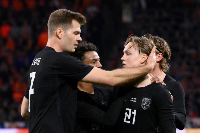 Norway's defender #21 Andreas Schjolberg (2R) celebrates with teammates after scoring his team's first goal during a friendly football match between the Netherlands and Norway at the Johan Cruijff Arena in Amsterdam on March 27, 2026. (Photo by JOHN THYS / AFP)