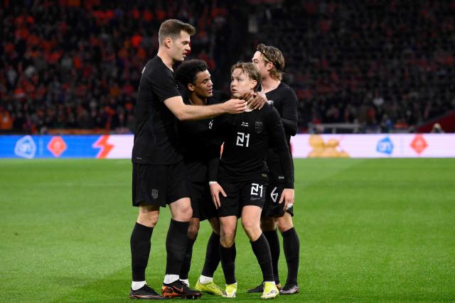 Norway's defender #21 Andreas Schjolberg (2R) celebrates with teammates after scoring his team's first goal during a friendly football match between the Netherlands and Norway at the Johan Cruijff Arena in Amsterdam on March 27, 2026. (Photo by JOHN THYS / AFP)