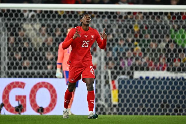 Switzerland’s forward #25 Joel Monteiro celebrates scoring his team's third goal during the international friendly football match between Switzerland and Germany at St. Jakob-Park in Basel, Switzerland on March 27, 2026. (Photo by Fabrice COFFRINI / AFP)