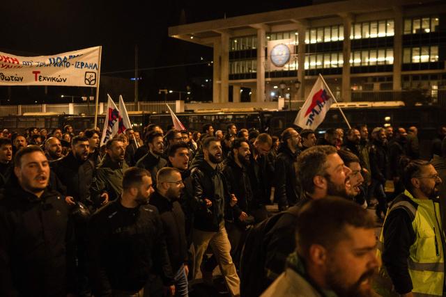 Demonstrators take part in a rally to protest against Greek military spendings and the country’s involvement in the war in Iran, in Athens, on March 27, 2026. (Photo by Angelos TZORTZINIS / AFP)