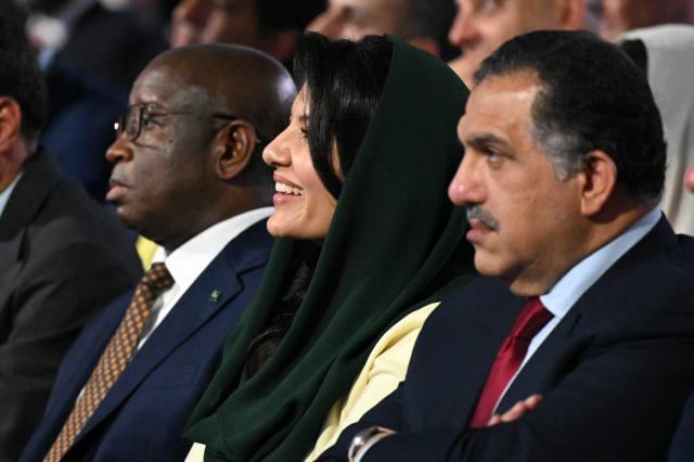 Saudi Arabian ambassador to the US, Princess Reema bint Bandar Al Saud (C), listens to US President Donald Trump address at the Future Investment Initiative (FII) Summit in Miami Beach, Florida, on March 27, 2026. (Photo by Mandel NGAN / AFP)