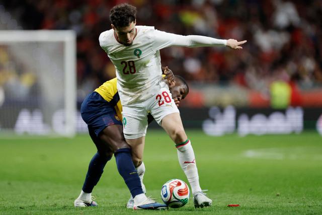 Morocco's  midfielder #28 Samir Elmourabet and Ecuador's  midfielder #23 Moises Caicedo fight for the ball during the international friendly football match between Morocco and Ecuador at Metropolitano Stadium in Madrid on March 27, 2026. (Photo by Oscar DEL POZO / AFP)