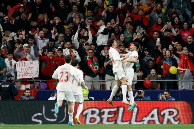 Morocco's  midfielder #24 Neil El Aynaoui (2R) celebrates scoring an equalizing goal with Morocco's defender #02 Achraf Hakimi (R) during the international friendly football match between Morocco and Ecuador at Metropolitano Stadium in Madrid on March 27, 2026. (Photo by Oscar DEL POZO / AFP)