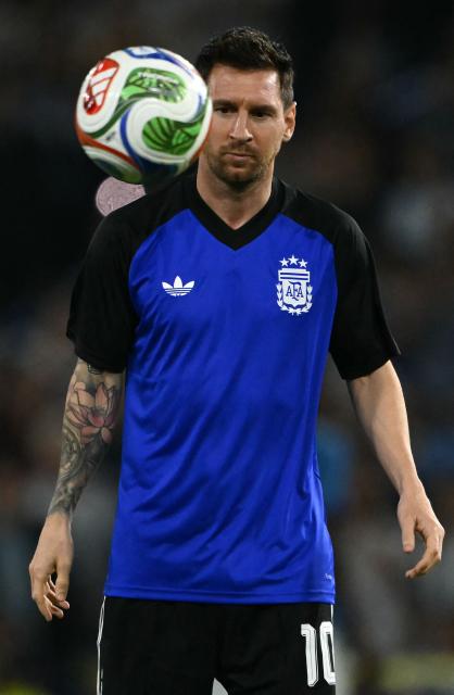 Argentina's forward Lionel Messi warms up ahead of a friendly football match between Argentina and Mauritania at La Bombonera stadium in Buenos Aires on March 27, 2026. (Photo by Luis ROBAYO / AFP)