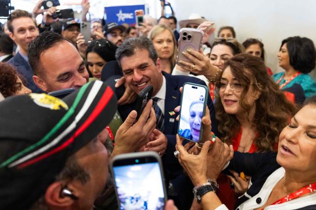 Former queen and empress of Iran Farah Pahlavi speaks on a video call with Iranian attendees during the Conservative Political Action Conference (CPAC) in Grapevine, Texas, on March 27, 2026. American conservatives converge on Texas this week for what organizers bill as their largest and most influential gathering, with the Iran war and fears of a punishing midterm election cycle heightening the stakes. (Photo by Leandro Lozada / AFP)