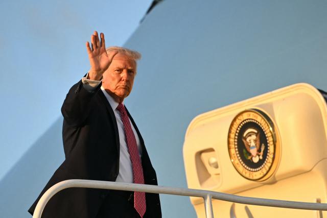 US President Donald Trump boards Air Force One before departing Miami International Airport in Miami, Florida on March 27, 2026. Trump is heading to Palm Beach, Florida to spend the weekend at his Mar-a-Lago resort. (Photo by Mandel NGAN / AFP)