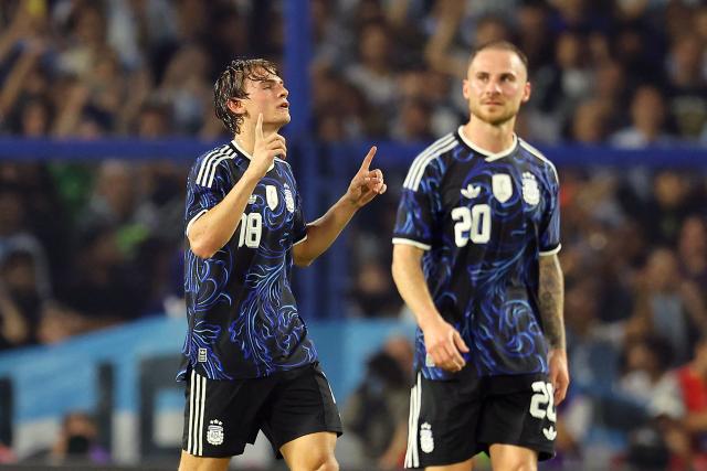 Argentina's midfielder #18 Nico Paz celebrates scoring his team's second goal next to teammate midfielder #20 Alexis Mac Allister during a friendly football match between Argentina and Mauritania at La Bombonera stadium in Buenos Aires on March 27, 2026. (Photo by ALEJANDRO PAGNI / AFP)