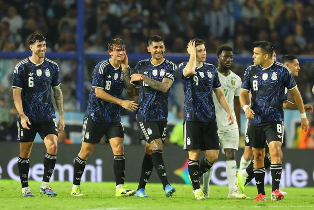 Argentina's midfielder #18 Nico Paz (2nd L) celebrates with teammates after scoring his team's second goal during a friendly football match between Argentina and Mauritania at La Bombonera stadium in Buenos Aires on March 27, 2026. (Photo by ALEJANDRO PAGNI / AFP)