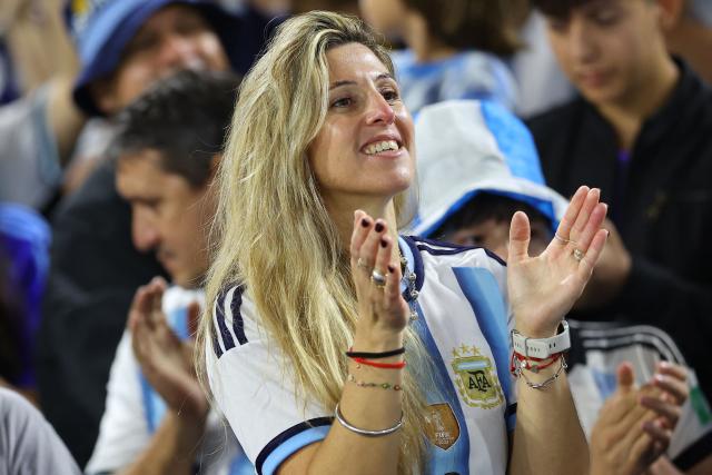 A fan of Argentina cheers for her team ahead of a friendly football match between Argentina and Mauritania at La Bombonera stadium in Buenos Aires on March 27, 2026. (Photo by ALEJANDRO PAGNI / AFP)