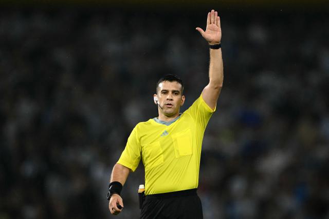 Paraguayan referee Derlis Lopez gestures during a friendly football match between Argentina and Mauritania at La Bombonera stadium in Buenos Aires on March 27, 2026. (Photo by Luis ROBAYO / AFP)