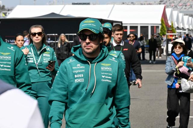 Aston Martin's Spanish driver Fernando Alonso arrives for the third practice session ahead of the Formula One Japanese Grand Prix at the Suzuka circuit in Suzuka, Mie prefecture on March 28, 2026. (Photo by Toshifumi KITAMURA / AFP)