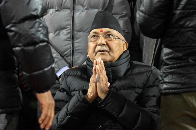 (FILES) Former Nepali Prime Minister and Chairman of the Communist Party of Nepal-Unified Marxist Leninist (CPN-UML), KP Sharma Oli, greets his supporters during the 11th General Convention of the party in Kathmandu on December 16, 2025. Nepal's former prime minister KP Sharma Oli and ex-home minister Ramesh Lekhak were arrested early on March 28, 2026 over their alleged involvement in a deadly crackdown on protestors in September, police said. (Photo by Prakash MATHEMA / AFP)