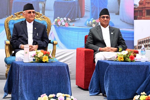 (FILES) Nepal's Prime Minister KP Sharma Oli (L) and Home Minister Ramesh Lekhak attend an event to mark the 10th anniversary of the 2015 earthquake, in Kathmandu on April 25, 2025. Nepal's former prime minister KP Sharma Oli and ex-home minister Ramesh Lekhak were arrested early on March 28, 2026 over their alleged involvement in a deadly crackdown on protestors in September, police said. (Photo by PRAKASH MATHEMA / AFP)
