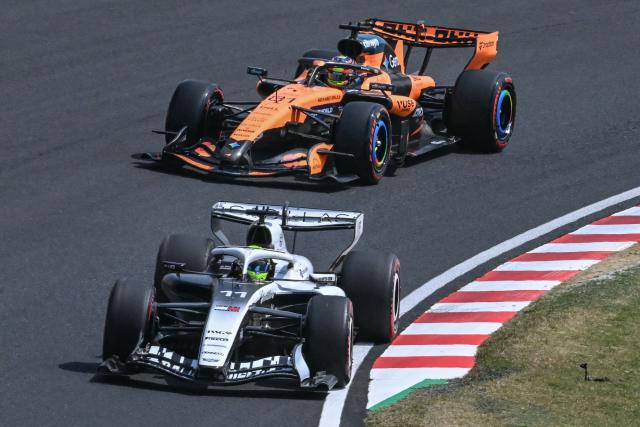 Cadillac's Mexican driver Sergio Perez and McLaren's Australian driver Oscar Piastri drive during the third practice session ahead of the Formula One Japanese Grand Prix at the Suzuka circuit in Suzuka, Mie prefecture on March 28, 2026. (Photo by ANDREW CABALLERO-REYNOLDS / AFP)