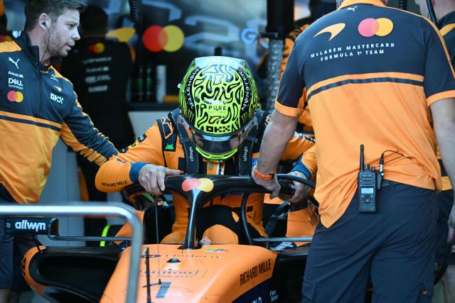 McLaren's British driver Lando Norris gets into his car during the third practice session ahead of the Formula One Japanese Grand Prix at the Suzuka circuit in Suzuka, Mie prefecture on March 28, 2026. (Photo by Toshifumi KITAMURA / AFP)