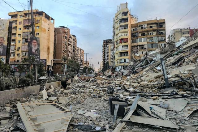 A photograph shows a portrait of Iran’s slain supreme leader Ayatollah Ali Khamenei and the rubble of a destroyed building at the site of an overnight Israeli airstrike in Beirut’s southern suburbs on March 28, 2026. Israel's military renewed its attacks on Beirut's southern suburbs on March 27, saying it was targeting Hezbollah infrastructure, as the Iran-backed group said the foes had clashed directly in the country's south. (Photo by AFP) / 