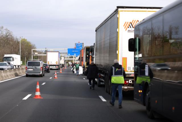 French truck drivers block the A7 motorway, south of Lyon, to protest against rising fuel prices, in Chasse-sur-Rhône, central eastern France, on March 28, 2026. (Photo by Alex MARTIN / AFP)