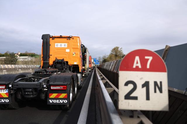French truck drivers block the A7 motorway, south of Lyon, to protest against rising fuel prices, in Chasse-sur-Rhône, central eastern France, on March 28, 2026. (Photo by Alex MARTIN / AFP)