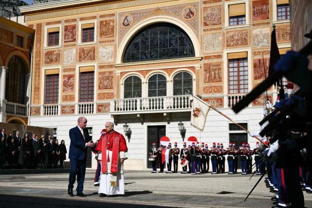 Prince's Albert II of Monaco and Pope Leo XIV take part in a welcome ceremony in the Prince's Palace of Monaco in Monte Carlo, Monaco, on March 28, 2026. Pope Leo XIV heads to the Mediterranean principality of Monaco on the French Riviera that is the pontiff's surprise pick for the first western European trip of his papacy. The US-born pope, a former missionary critical of the wealthy elite, will helicopter in for a day in the world's second-smallest state, best known for its casinos, luxury yachts and Michelin-starred dining. (Photo by Marco BERTORELLO / AFP)