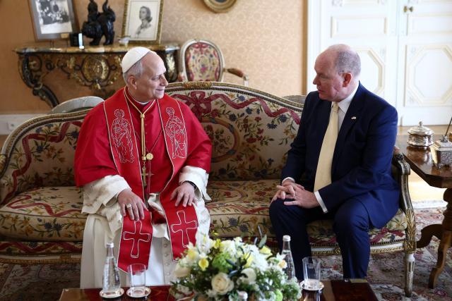Pope Leo XIV meets with Prince Albert II of Monaco during a private audience in the Prince's Palace of Monaco in Monte Carlo, Monaco, on March 28, 2026. Pope Leo XIV heads to the Mediterranean principality of Monaco on the French Riviera that is the pontiff's surprise pick for the first western European trip of his papacy. The US-born pope, a former missionary critical of the wealthy elite, will helicopter in for a day in the world's second-smallest state, best known for its casinos, luxury yachts and Michelin-starred dining. (Photo by Guglielmo Mangiapane / POOL / AFP)