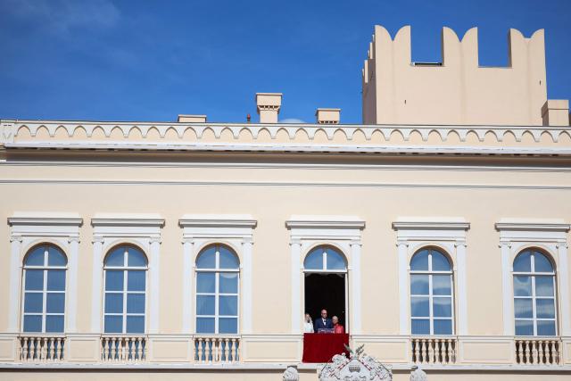 Prince's Albert II of Monaco gives a speech from the balcony next to Pope Leo XIV (R) and Princess Charlene of Monaco at the Prince's Palace of Monaco in Monte Carlo, Monaco, on March 28, 2026. Pope Leo XIV heads to the Mediterranean principality of Monaco on the French Riviera that is the pontiff's surprise pick for the first western European trip of his papacy. The US-born pope, a former missionary critical of the wealthy elite, will helicopter in for a day in the world's second-smallest state, best known for its casinos, luxury yachts and Michelin-starred dining. (Photo by Valery HACHE / AFP)