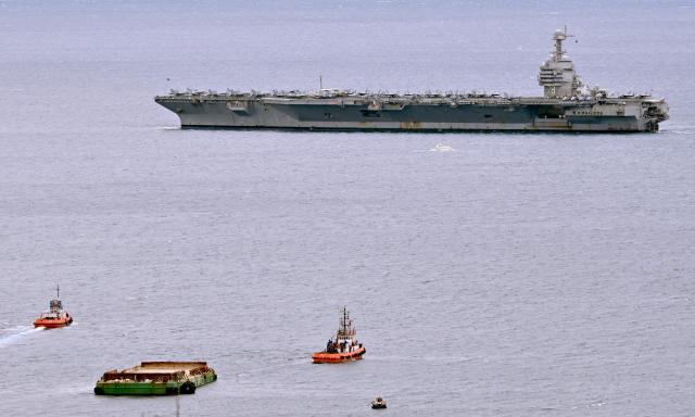 The world's largest aircraft carrier USS Gerald R. Ford, that has been part of Middle East war operations, arrives in the Croatian coastal city of Split for a scheduled port visit and maintenance stop on March 28, 2026.  (Photo by ELVIS BARUKCIC / AFP)