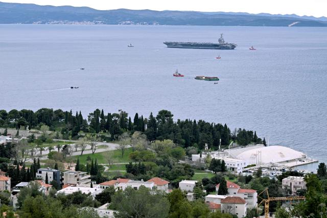 The world's largest aircraft carrier USS Gerald R. Ford, that has been part of Middle East war operations, arrives in the Croatian coastal city of Split for a scheduled port visit and maintenance stop on March 28, 2026.  (Photo by ELVIS BARUKCIC / AFP)