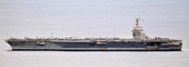 The world's largest aircraft carrier USS Gerald R. Ford, that has been part of Middle East war operations, arrives in the Croatian coastal city of Split for a scheduled port visit and maintenance stop on March 28, 2026.  (Photo by ELVIS BARUKCIC / AFP)