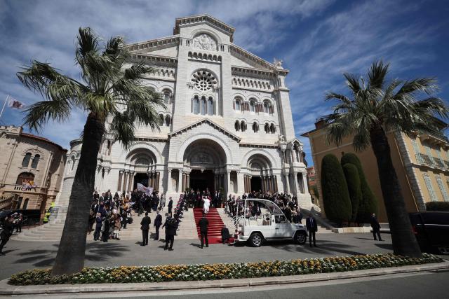 Pope Leo XIV leaves after meeting with members of the catholic community in the Cathedral of the Immaculate Conception in Monte Carlo, Monaco, on March 28, 2026. Pope Leo XIV heads to the Mediterranean principality of Monaco on the French Riviera that is the pontiff's surprise pick for the first western European trip of his papacy. The US-born pope, a former missionary critical of the wealthy elite, will helicopter in for a day in the world's second-smallest state, best known for its casinos, luxury yachts and Michelin-starred dining. (Photo by Valery HACHE / AFP)