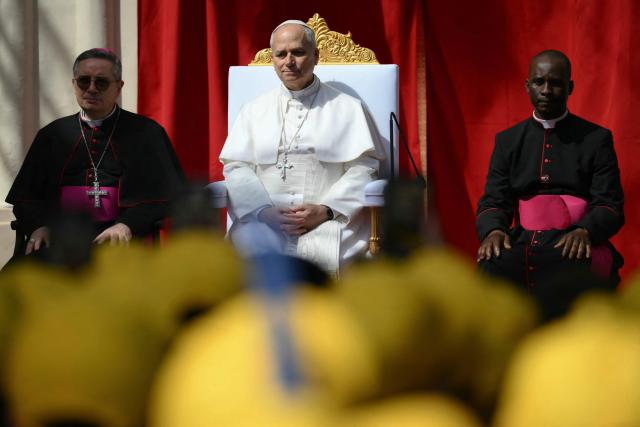 Pope Leo XIV meets with youths and catechumens in front of the Church of Sainte-Devote in Monte Carlo, Monaco, on March 28, 2026. Pope Leo XIV heads to the Mediterranean principality of Monaco on the French Riviera that is the pontiff's surprise pick for the first western European trip of his papacy. The US-born pope, a former missionary critical of the wealthy elite, will helicopter in for a day in the world's second-smallest state, best known for its casinos, luxury yachts and Michelin-starred dining. (Photo by Marco BERTORELLO / AFP)