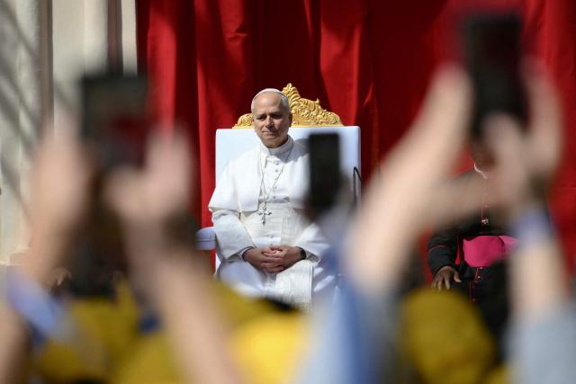 Pope Leo XIV meets with youths and catechumens in front of the Church of Sainte-Devote in Monte Carlo, Monaco, on March 28, 2026. Pope Leo XIV heads to the Mediterranean principality of Monaco on the French Riviera that is the pontiff's surprise pick for the first western European trip of his papacy. The US-born pope, a former missionary critical of the wealthy elite, will helicopter in for a day in the world's second-smallest state, best known for its casinos, luxury yachts and Michelin-starred dining. (Photo by Marco BERTORELLO / AFP)