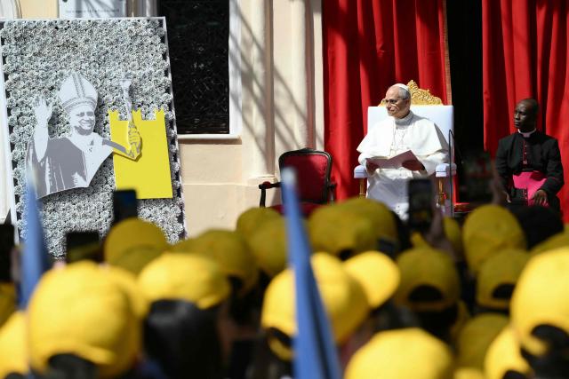 Pope Leo XIV adresses youth and catechumens in front of the Church of Sainte-Devote in Monte Carlo, Monaco, on March 28, 2026. Pope Leo XIV heads to the Mediterranean principality of Monaco on the French Riviera that is the pontiff's surprise pick for the first western European trip of his papacy. The US-born pope, a former missionary critical of the wealthy elite, will helicopter in for a day in the world's second-smallest state, best known for its casinos, luxury yachts and Michelin-starred dining. (Photo by Marco BERTORELLO / AFP)