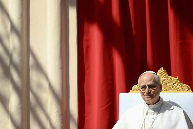 Pope Leo XIV meets with youth and catechumens in front of the Church of Sainte-Devote in Monte Carlo, Monaco, on March 28, 2026. Pope Leo XIV heads to the Mediterranean principality of Monaco on the French Riviera that is the pontiff's surprise pick for the first western European trip of his papacy. The US-born pope, a former missionary critical of the wealthy elite, will helicopter in for a day in the world's second-smallest state, best known for its casinos, luxury yachts and Michelin-starred dining. (Photo by Marco BERTORELLO / AFP)