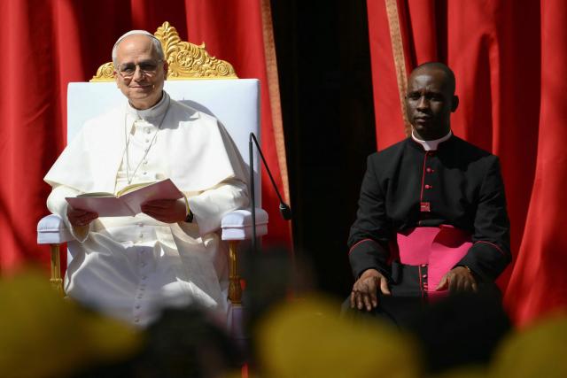 Pope Leo XIV meets with youth and catechumens in front of the Church of Sainte-Devote in Monte Carlo, Monaco, on March 28, 2026. Pope Leo XIV heads to the Mediterranean principality of Monaco on the French Riviera that is the pontiff's surprise pick for the first western European trip of his papacy. The US-born pope, a former missionary critical of the wealthy elite, will helicopter in for a day in the world's second-smallest state, best known for its casinos, luxury yachts and Michelin-starred dining. (Photo by Marco BERTORELLO / AFP)
