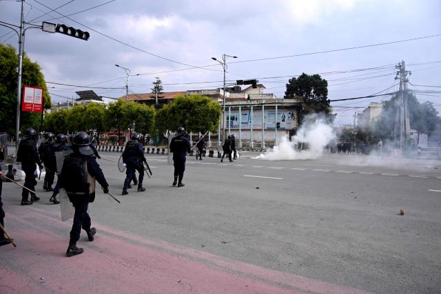 Police clash with Nepali former prime minister KP Sharma Oli's supporters as they protest against his arrest in Kathmandu on March 28, 2026. Nepal's former prime minister KP Sharma Oli and ex-home minister Ramesh Lekhak were arrested March 28 over their alleged involvement in a deadly crackdown on protestors in September, police said. (Photo by PRAKASH MATHEMA / AFP)