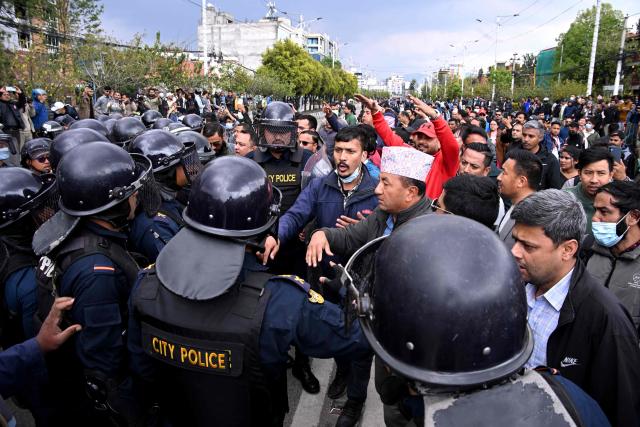 Supporters protest against the arrest of Nepali former prime minister KP Sharma Oli in Kathmandu on March 28, 2026. Nepal's former prime minister KP Sharma Oli and ex-home minister Ramesh Lekhak were arrested March 28 over their alleged involvement in a deadly crackdown on protestors in September, police said. (Photo by PRAKASH MATHEMA / AFP)