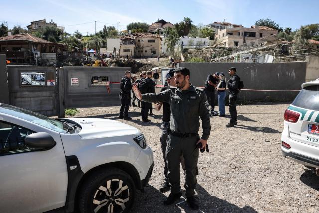 First responders and security forces work at the site of a projectile strike in Eshtaol, near Beit Shemesh in central Israel, on March 28, 2026. The Middle East was sparked by joint US-Israeli strikes on Iran that triggered a wave of retaliatory missile and drone attacks against Israel and several other countries in the region. (Photo by AHMAD GHARABLI / AFP) / 