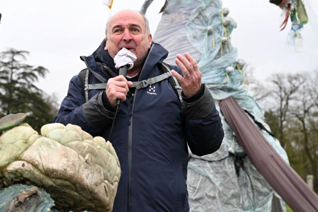 Vosges Nature Environment association president Bernard Schmitt gives a speech before "A water carnaval against Nestle and its world", a protest action called by environmental protection organisations against Nestle Waters in Nancy on March 28, 2026. The Nestle Waters trial over illegal waste dumps in the Vosges department took place from March 23 to 26 in Nancy. The public prosecutor’s office sought a fine of Ђ750,000 – the maximum penalty available – against Nestle Waters Supply Est. (Photo by Jean-Christophe VERHAEGEN / AFP)
