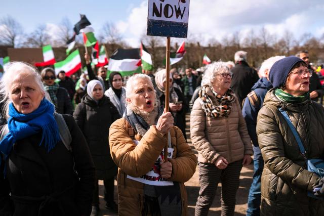 Protestors shout slogans as they take part in a demonstration against military attacks by the United States and Israel on Iran entitled 'Stop the war against Iran!'  on the Malieveld in The Hague on March 28, 2026. (Photo by Lina Selg / ANP / AFP) / Netherlands OUT