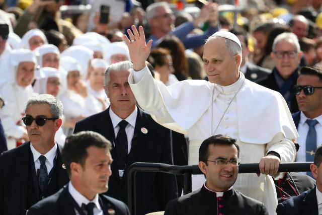 Pope Leo XIV waves as he arrives to lead a Holy Mass at the Louis II Stadium in Monaco, on March 28, 2026. Pope Leo XIV denounced the widening gap between the haves and have-nots as he visited Monaco, a millionaires' playground that is the surprise pick for the first western European trip of his papacy. (Photo by Marco BERTORELLO / AFP)