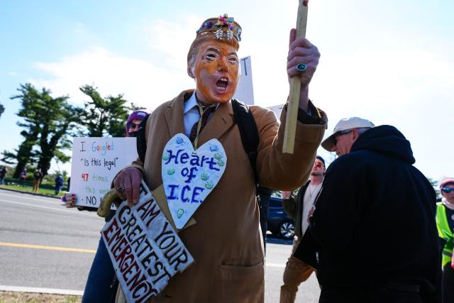 Demonstrators prepare to walk across the Memorial Bridge from Arlington, Virginia into Washington, DC, during the "No Kings" national day of protest on March 28, 2026. Nationwide protests against US President Donald Trump are expected Saturday as millions of people vent fury over what they see as his authoritarian bent and other forms of cruel, law-trampling governance. It is the third time in less than a year that Americans will take to the streets as part of a grassroots movement called "No Kings," the most vocal and visual conduit for opposition to Trump since he began his second term in January 2025. (Photo by Aaron Schwartz / AFP)