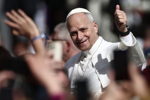 Pope Leo XIV gives a thumb up as he arrives to lead a Holy Mass at the Louis II Stadium in Monaco, on March 28, 2026. Pope Leo XIV denounced the widening gap between the haves and have-nots as he visited Monaco, a millionaires' playground that is the surprise pick for the first western European trip of his papacy. (Photo by Thibaud MORITZ / AFP)