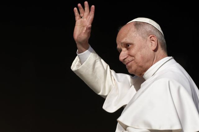 Pope Leo XIV waves as he arrives to lead a Holy Mass at the Louis II Stadium in Monaco, on March 28, 2026. Pope Leo XIV denounced the widening gap between the haves and have-nots as he visited Monaco, a millionaires' playground that is the surprise pick for the first western European trip of his papacy. (Photo by Thibaud MORITZ / AFP)
