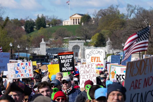 Demonstrators walk across the Memorial Bridge from Arlington, Virginia into Washington, DC, during the "No Kings" national day of protest on March 28, 2026. Nationwide protests against US President Donald Trump are expected Saturday as millions of people vent fury over what they see as his authoritarian bent and other forms of cruel, law-trampling governance. It is the third time in less than a year that Americans will take to the streets as part of a grassroots movement called "No Kings," the most vocal and visual conduit for opposition to Trump since he began his second term in January 2025. (Photo by Ken Cedeno / AFP)