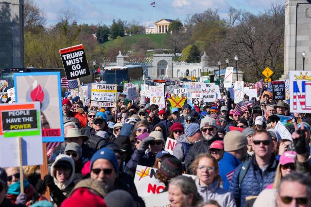 Demonstrators walk across the Memorial Bridge from Arlington, Virginia into Washington, DC, during the "No Kings" national day of protest on March 28, 2026. Nationwide protests against US President Donald Trump are expected Saturday as millions of people vent fury over what they see as his authoritarian bent and other forms of cruel, law-trampling governance. It is the third time in less than a year that Americans will take to the streets as part of a grassroots movement called "No Kings," the most vocal and visual conduit for opposition to Trump since he began his second term in January 2025. (Photo by Ken Cedeno / AFP)