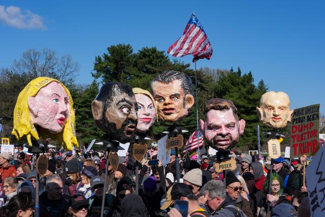 Demonstrators hold effigies of Trump administration officials during the "No Kings" national day of protest near the Memorial Bridge in Washington, DC, on March 28, 2026. Nationwide protests against US President Donald Trump are expected Saturday as millions of people vent fury over what they see as his authoritarian bent and other forms of cruel, law-trampling governance. It is the third time in less than a year that Americans will take to the streets as part of a grassroots movement called "No Kings," the most vocal and visual conduit for opposition to Trump since he began his second term in January 2025. (Photo by Ken Cedeno / AFP)