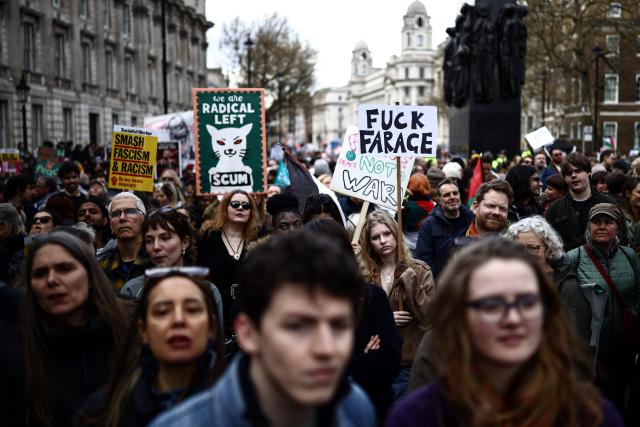 EDITORS NOTE: Graphic content / Protesters holding placards gather ahead of speeches after a march against the far right, organised by the Together Alliance, in central London on March 28, 2026. (Photo by Henry NICHOLLS / AFP)