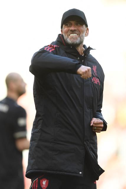 Liverpool Legends' manager Jurgen Klopp celebrates on the pitch after the Legends football match between Liverpool Legends and Dortmund Legends at Anfield in Liverpool, north-west England on March 28, 2026. (Photo by PETER POWELL / AFP)